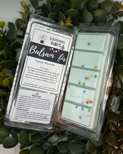 a laptop computer sitting on top of a plant 