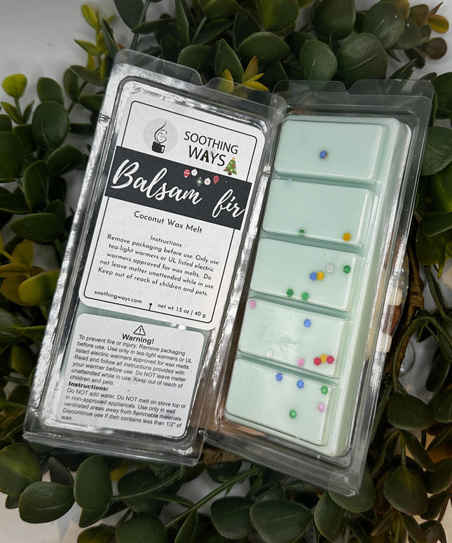 a laptop computer sitting on top of a plant 