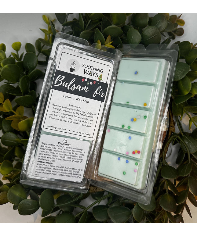 a laptop computer sitting on top of a plant 