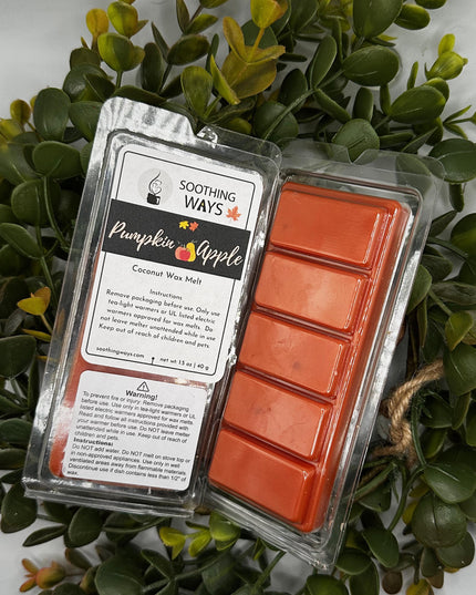 a sign that is sitting in front of a plant 