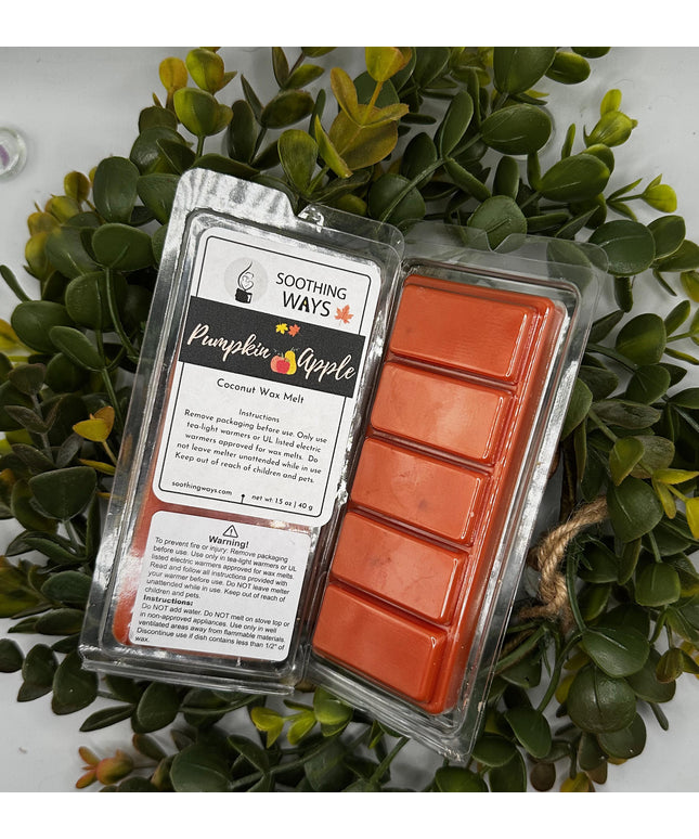 a sign that is sitting in front of a plant 