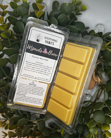 an open laptop computer sitting on top of a plant 