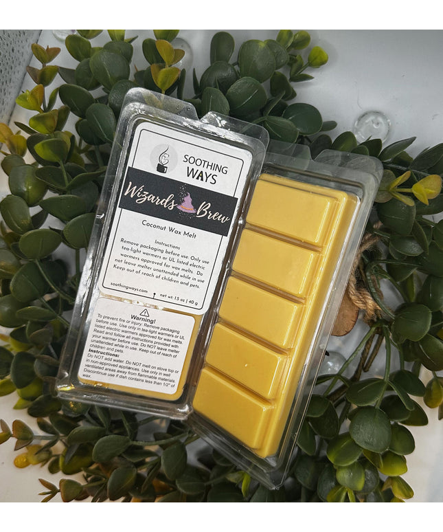 an open laptop computer sitting on top of a plant 